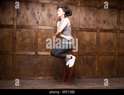 Girl jumping on skipping rope Stock Photo