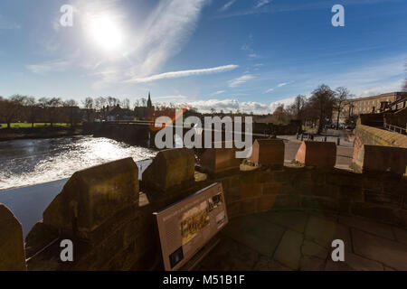 City of Chester, England. Silhouette of Chester’s medieval Old Dee Bridge over the River Dee with Handbridge in the background. Stock Photo