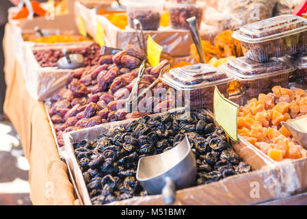Close up assorted dried fruits and berries on market place in Tel Aviv, Israel. Selective focus, space for text Stock Photo
