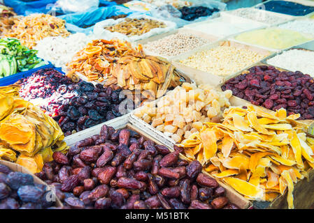 Close up assorted dried fruits and berries on market place in Tel Aviv, Israel. Selective focus, space for text Stock Photo