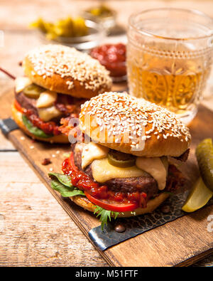 Two cheeseburgers on sesame buns Stock Photo