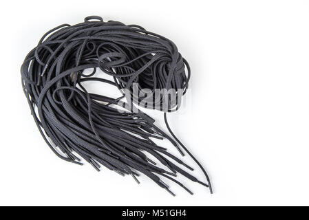 Black spare shoe laces on the white background Stock Photo