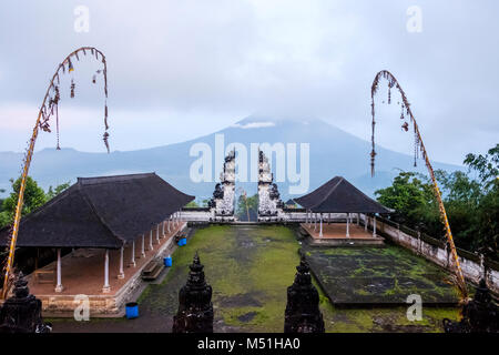 Balinese split gateway ('candi bentar') and outer sanctum, with Mt. Agung in the distance, Pura Lempuyang temple, Bali, Indonesia. Stock Photo