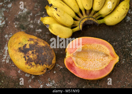 Colorful papayas and bananas Stock Photo