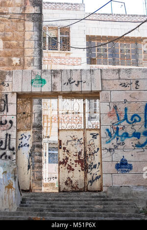 HEBRON, ISRAEL - AUGUST 04, 2010: Vertical picture of open door building  in Hebron, Israel. Stock Photo