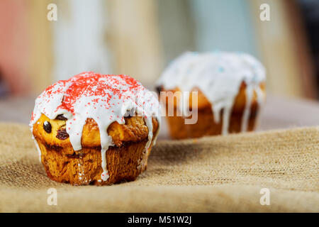 Easter traditional ukrainian decorated cake paska, kulich Row of colored and decorated Easter eggs Stock Photo