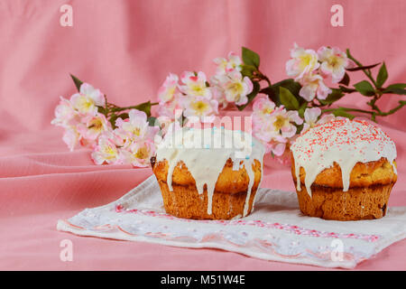 Easter eggs and cake on the bright background Easter composition of sweet bread, paska Stock Photo