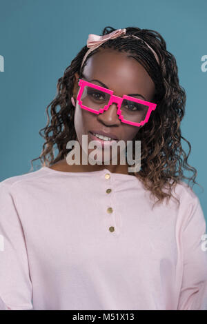 Cute african woman wearing freak fashion glasses Stock Photo