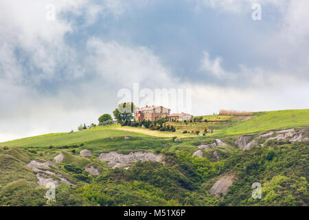 Farm on a field at a deep ravine Stock Photo