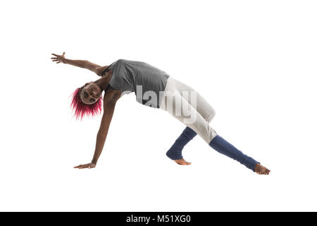 Young african woman doing yoga exercises isolated on white background Stock Photo