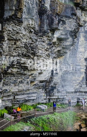 The Indian Ladder trail passes under Minelot Falls, a waterfall in John Boyd Thacher State Park, a state park near Albany, New York. Located mostly at Stock Photo