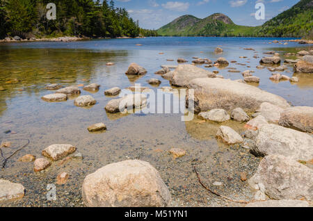 Jordan Pond is an oligotrophic tarn in Acadia National Park near the town of Bar Harbor, Maine. It covers 187 acres, with a maximum depth of 150 feet  Stock Photo