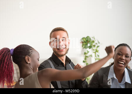 Business team celebrating a good job in the office Stock Photo