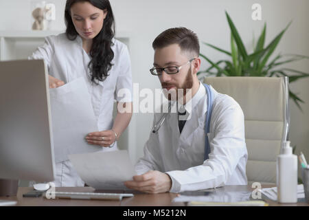 Two doctors discussing test results Stock Photo