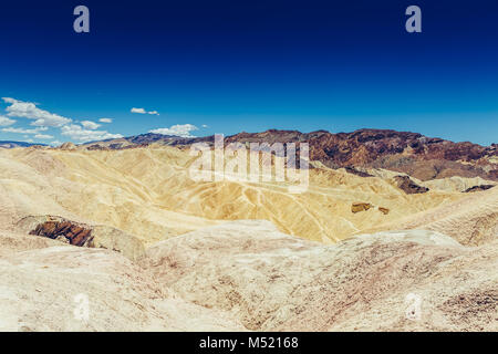 Panoramic view of mudstone and claystone badlands at Zabriskie Point. Death Valley National Park, California USA. Stock Photo