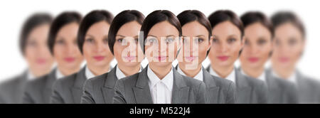 Group of business women clones standing in a row Stock Photo