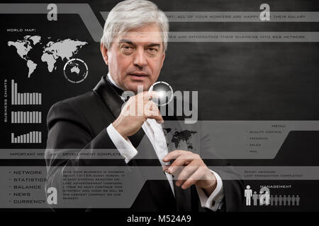 Businessman pressing high tech type of modern buttons on a virtual background Stock Photo