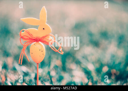 Easter background concept with yellow bunny figure Stock Photo