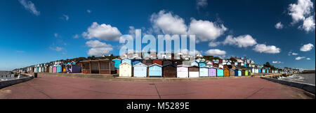 Colourful beach hut panorama at Clacton-on-Sea is the largest town in the Tendring peninsula and district in Essex, England Stock Photo