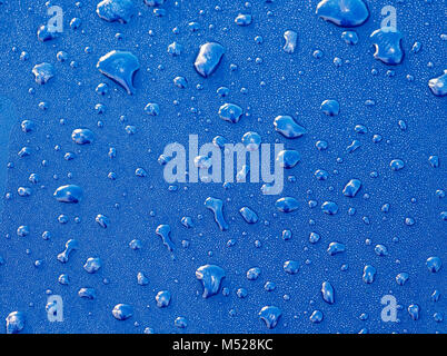 Details,Water droplets on blue paint Stock Photo