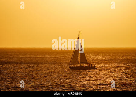 Sailboat on sea in the evening light,Atlantic Ocean,La Gomera,Canary Islands,Canary Islands,Spain Stock Photo