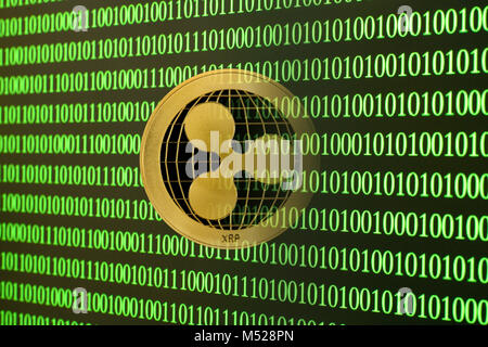 Symbol image Cryptocurrency,digital currency,golden coin ripple with binary code,background image Stock Photo