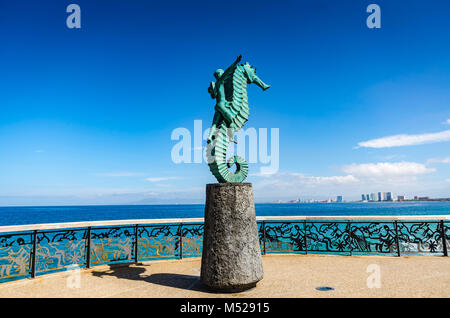 Iconic verdigris green bronze sculpture entitled 'The Boy on the Seahorse' by Rafael Zamarripa on artwalk along Malecon in Puerto Vallarta. Stock Photo