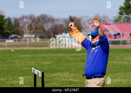 Race official shoots gun to start Track and Field race in Albany, NY.re Stock Photo