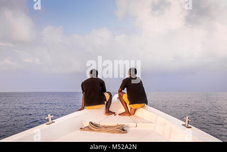 Two deckhands on a bow in Maldives Stock Photo