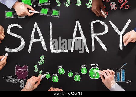 Hands Drawing Salary Word On Black Blackboard Stock Photo