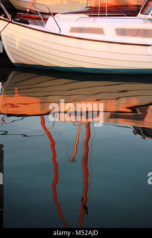 sail boats reflected in water Stock Photo - Alamy