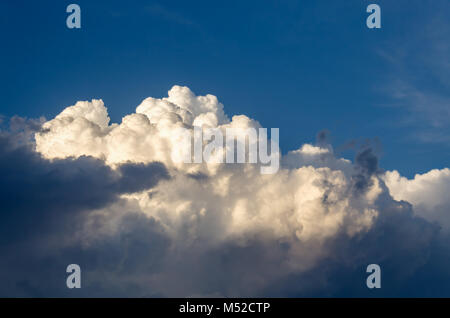 fluffy white cumulus clouds against the blue sky after the rain Stock Photo