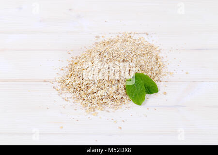 pile of rolled oats on white background Stock Photo