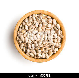 Dried borlotti beans in bowl isolated on white background. Top view. Stock Photo