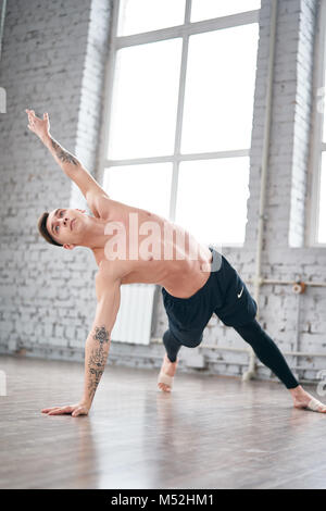 Handsome ballet dancer training in the gym Stock Photo