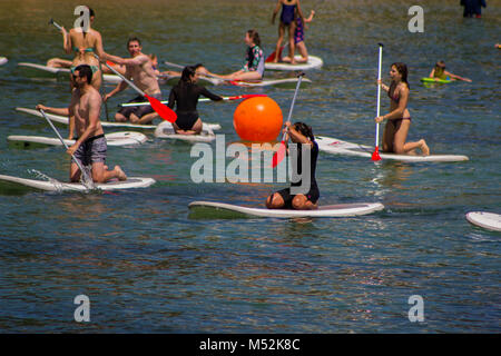 Sydney, Australia: Group of people having fun with paddle surf Stock Photo