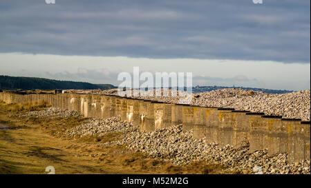 World War II defence line of anti tank concrete blocks on shingle beach ...