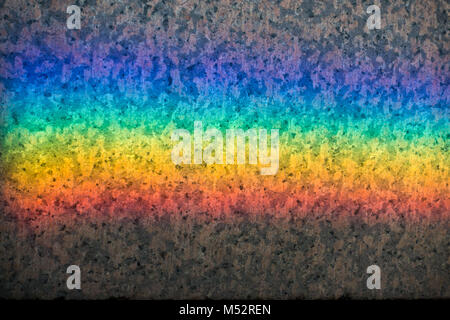 Colorful rainbow reflection on a stone backgroud Stock Photo