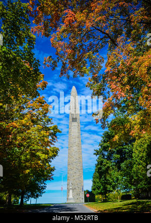 Bennington Battle Monument framed by colorful fall foliage in Bennington, VT, USA. Stock Photo
