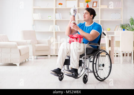 Disabled boxer at wheelchair recovering from injury Stock Photo