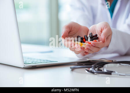 Medical concept with medicines and laptop computer Stock Photo