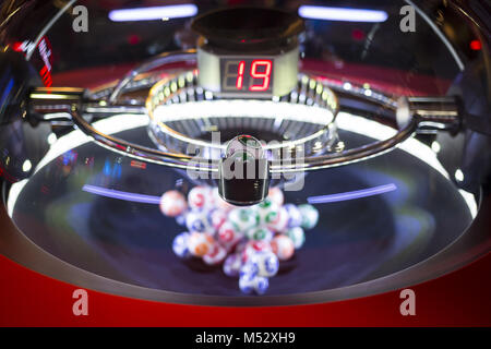 Colourful lottery balls in a machine 19 Stock Photo