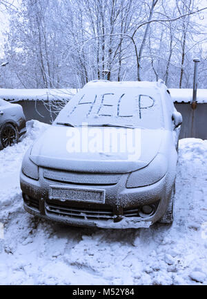 Word help on snow covered car Stock Photo