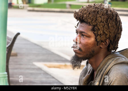 Bridgetown, Barbados - January 31th, 2018: Portrait of native man with dreadlocks from Barbados looking away at the Bridgetown waterfront. Stock Photo