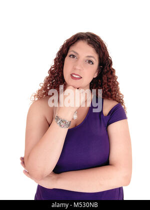 Portrait of woman standing with hand under chin Stock Photo