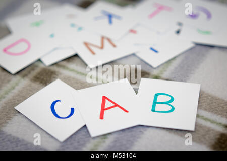 English; Learning the New Word with the Alphabet Cards Stock Photo