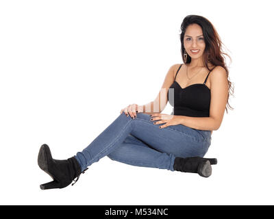 Slim woman sitting on the floor Stock Photo