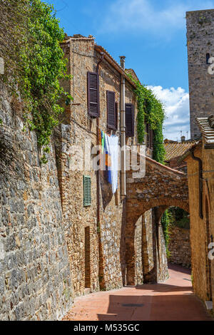 Old village with hanging laundry in a alley Stock Photo