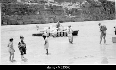 OTIS MARSTON RIVER EXPEDITION WITH FIVE MOTORBOATS PREPARING TO LEAVE FOR TRIP THROUGH GRAND CANYON FROM LEE'S FERRY WHERE THIS PHOTO WAS TAKEN.  PHOTOGRAPHER H.C. BRYANT.  CIRCA 1951.  . Stock Photo