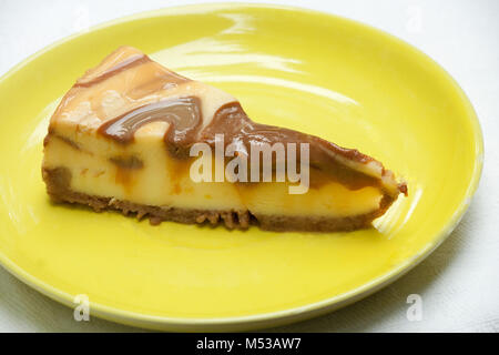 Carmel Cheesecake on Yellow Plate Isolated Stock Photo